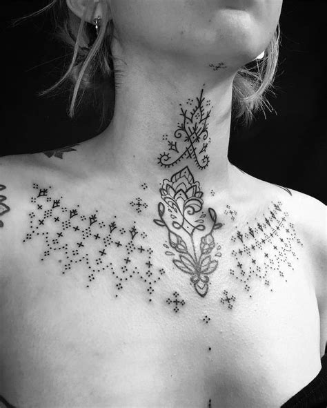 between chest tattoo female|Between chest tattoo female